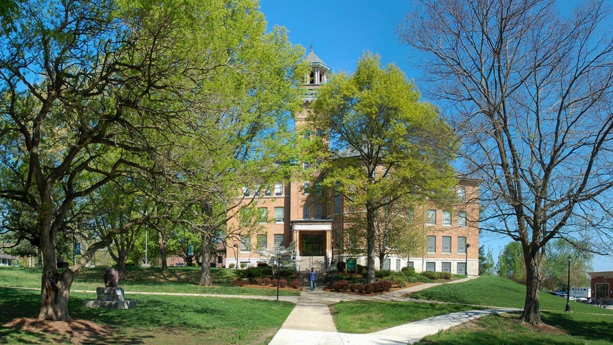 Central Methodist University with trees in view of the front oft the building.